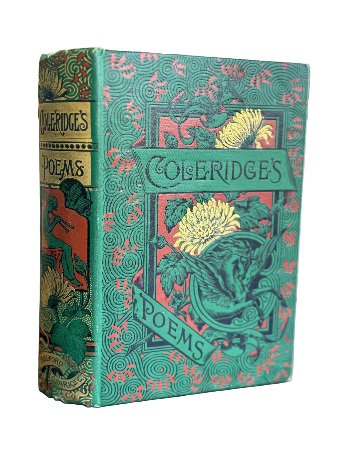 Decorative book titled 'Cole-Ridges Poems' with intricate design on a wooden surface.
