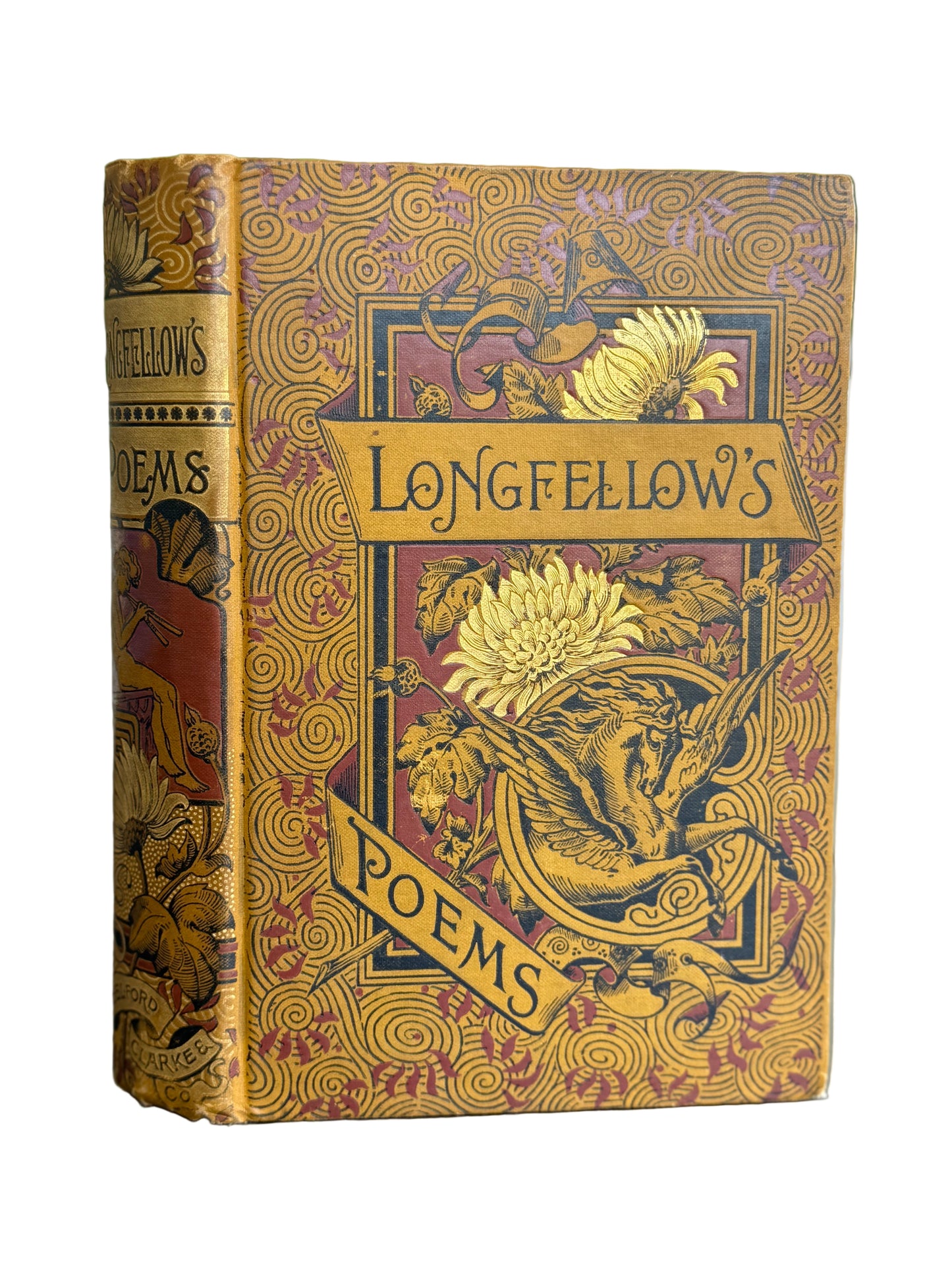Decorative book cover of 'Longfellow's Poems' with intricate designs on a blurred background