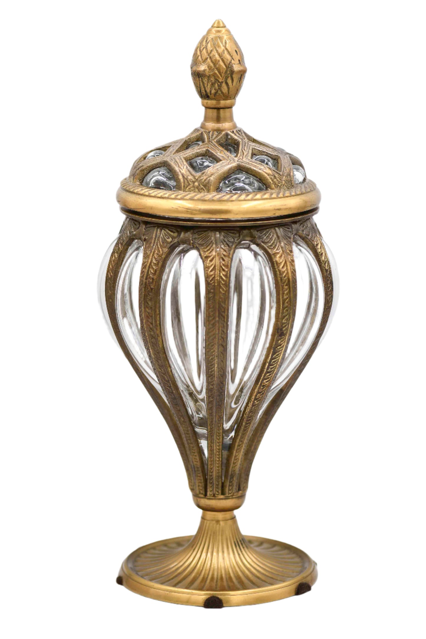 A vintage bubble glass apothecary jar with brass embellishments and a decorative lid, featuring an embossed design and a finial on top.