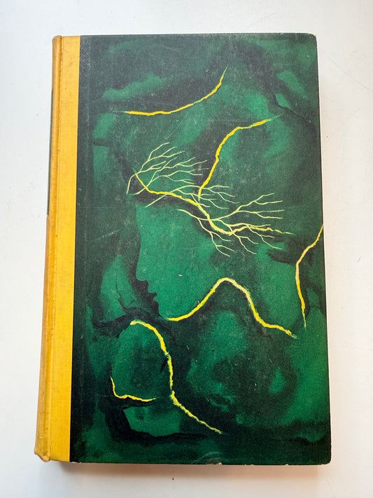 Green marbled notebook with gold edges on a white background