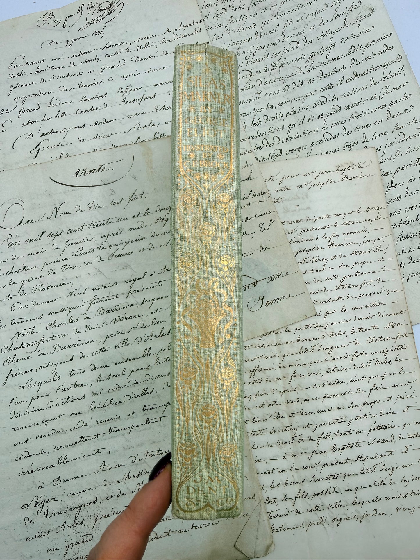 Decorative book with gold embossing on an old document