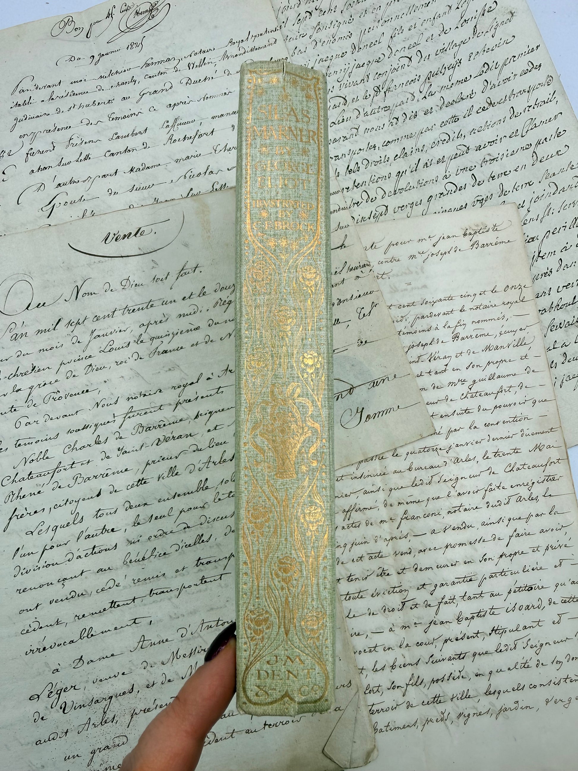 Decorative book with gold embossing on an old document