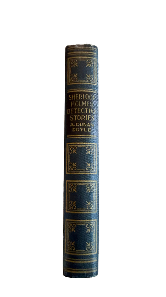 Vintage book titled 'Sherlock Holmes Detective Stories' on decorative background