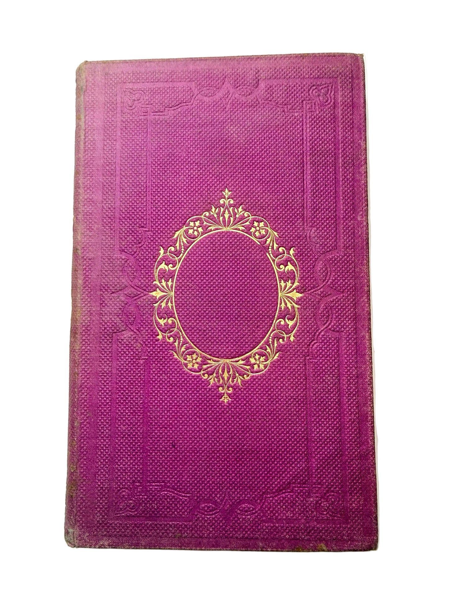 Purple book with gold embossed design on a white background