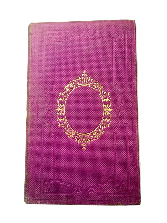 Purple book with gold embossed design on a white background