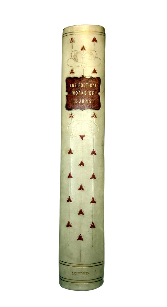 Tall cylindrical book with decorative cover on a light gray background