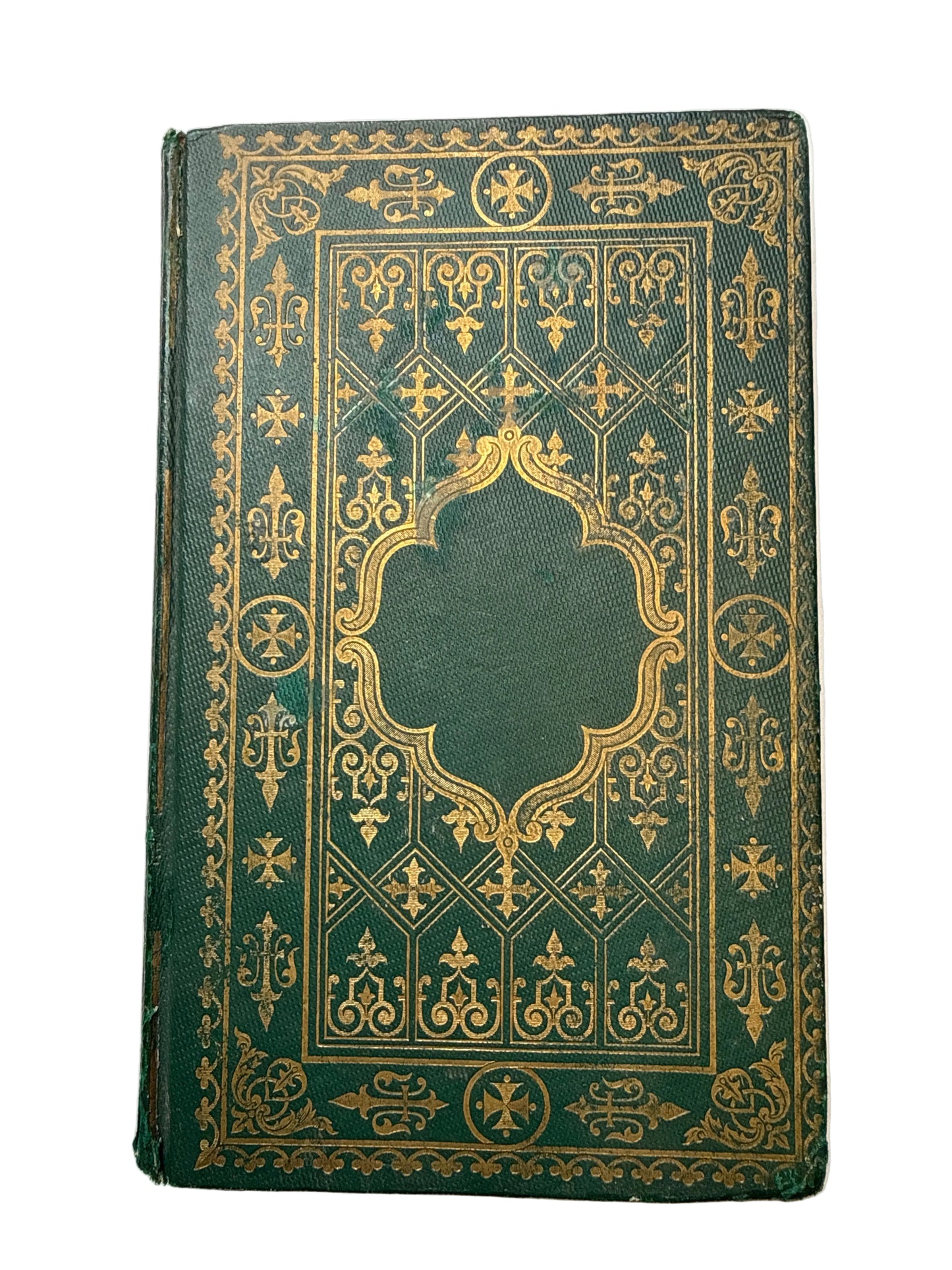 Decorative green book with gold embossed patterns on a white background