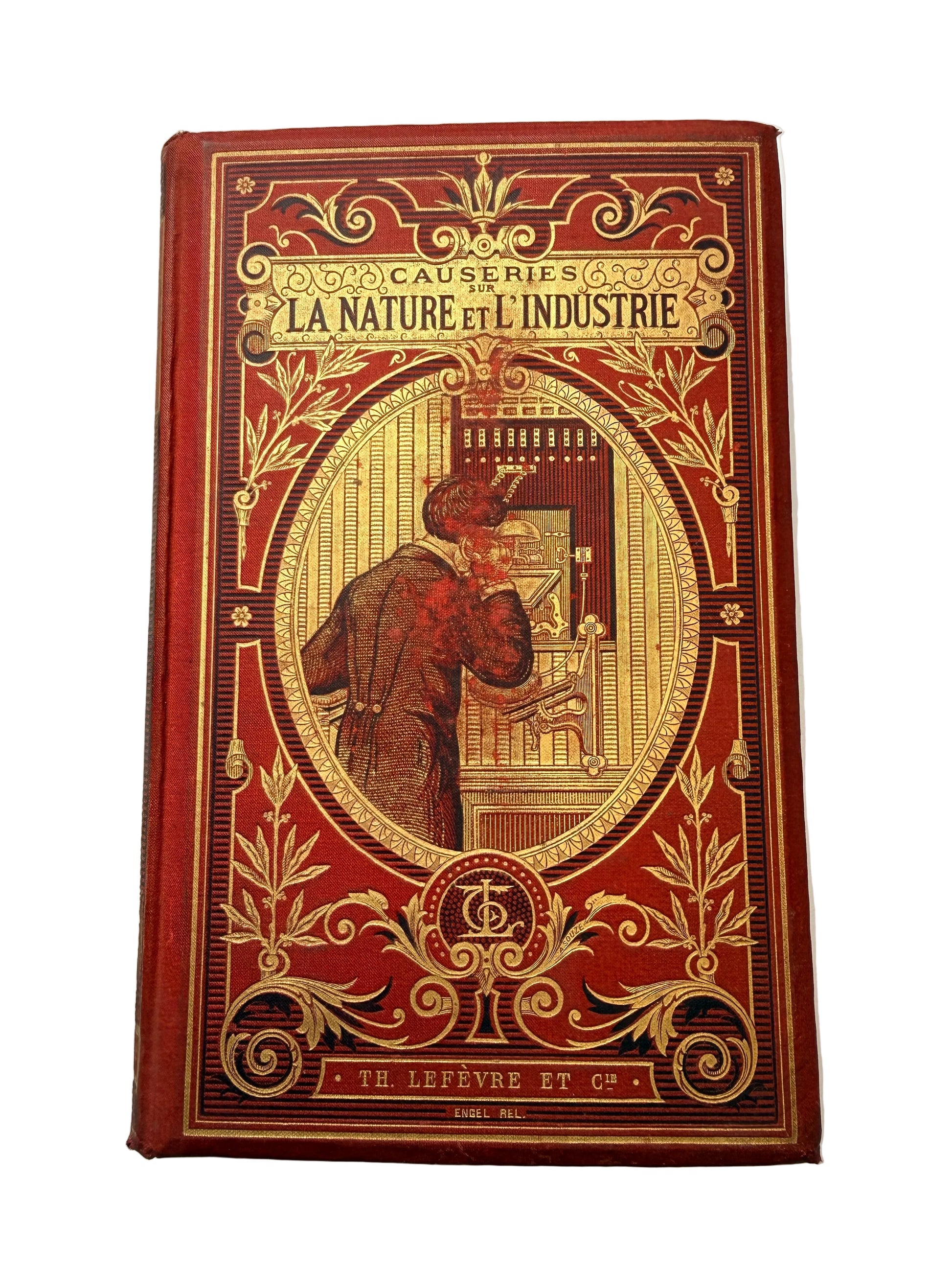 Decorative book with intricate gold designs on a white background