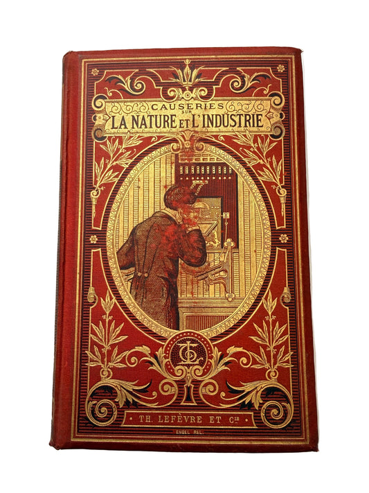 Decorative book with intricate gold designs on a white background