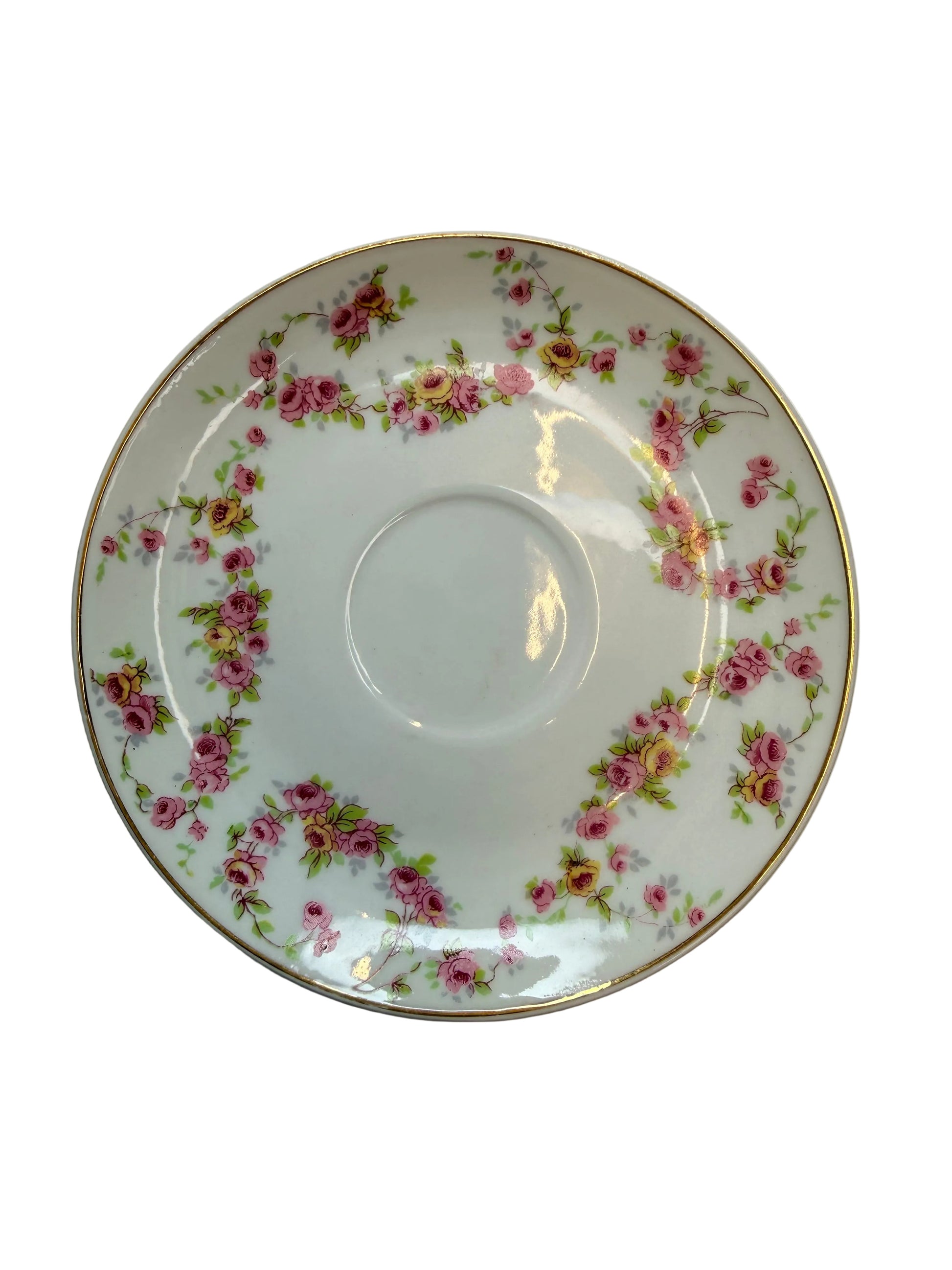 Decorative ceramic plate with floral pattern on a plain background