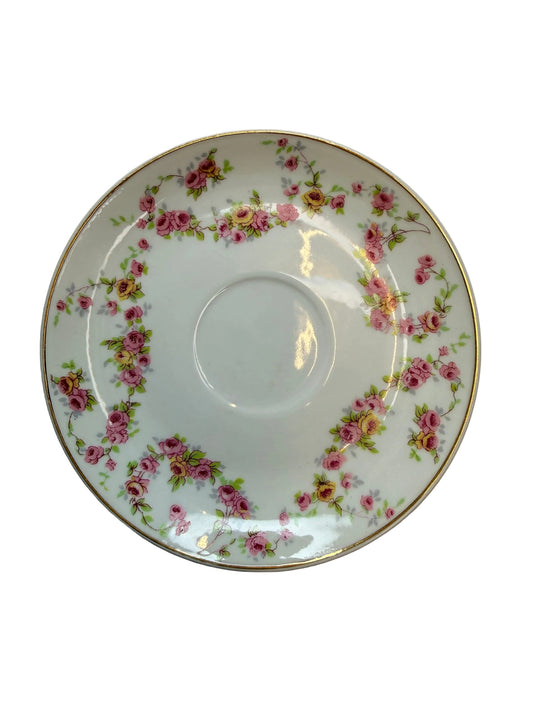 Decorative ceramic plate with floral pattern on a plain background
