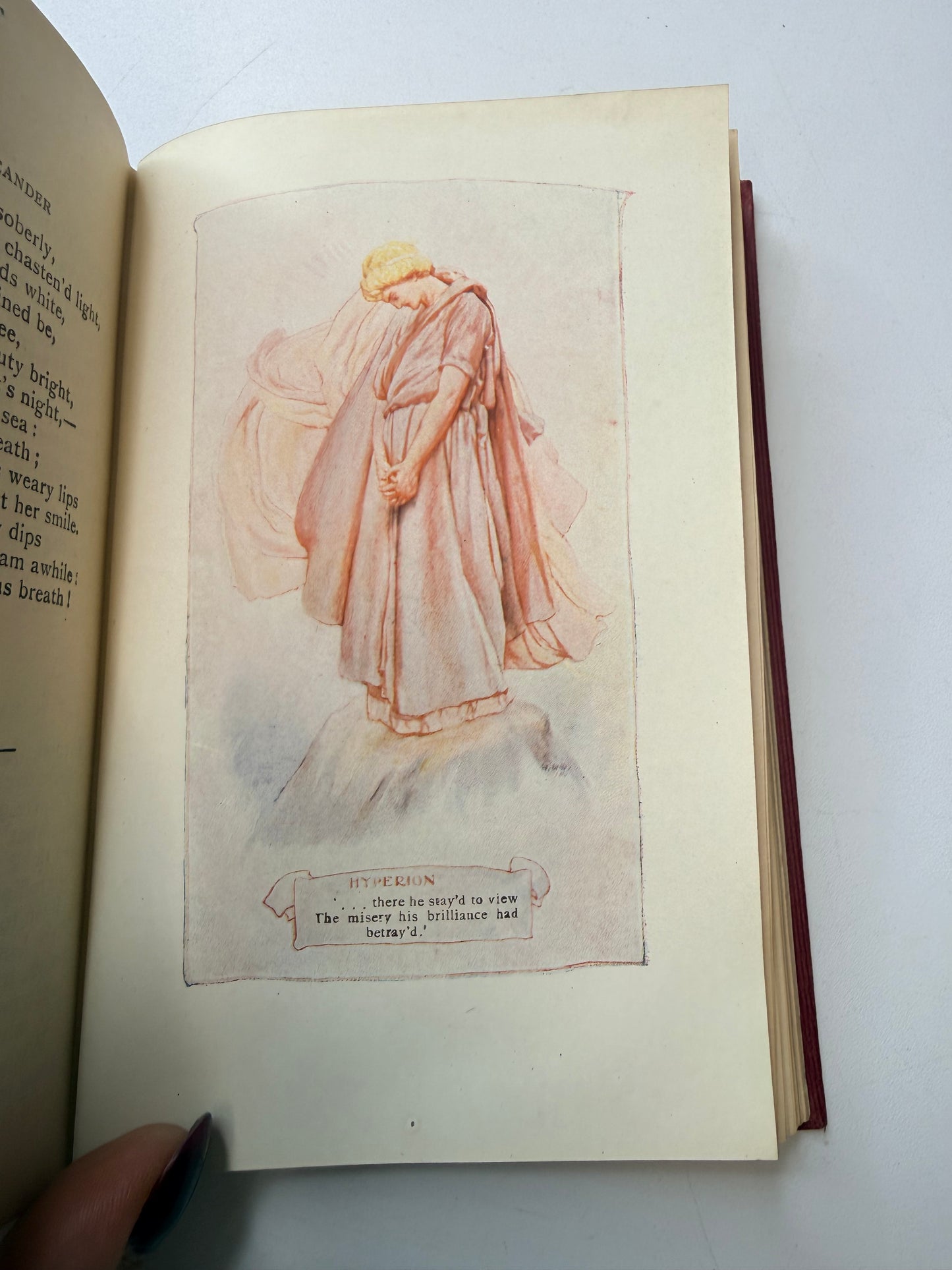 Open book with a drawing of a classical statue on a white background