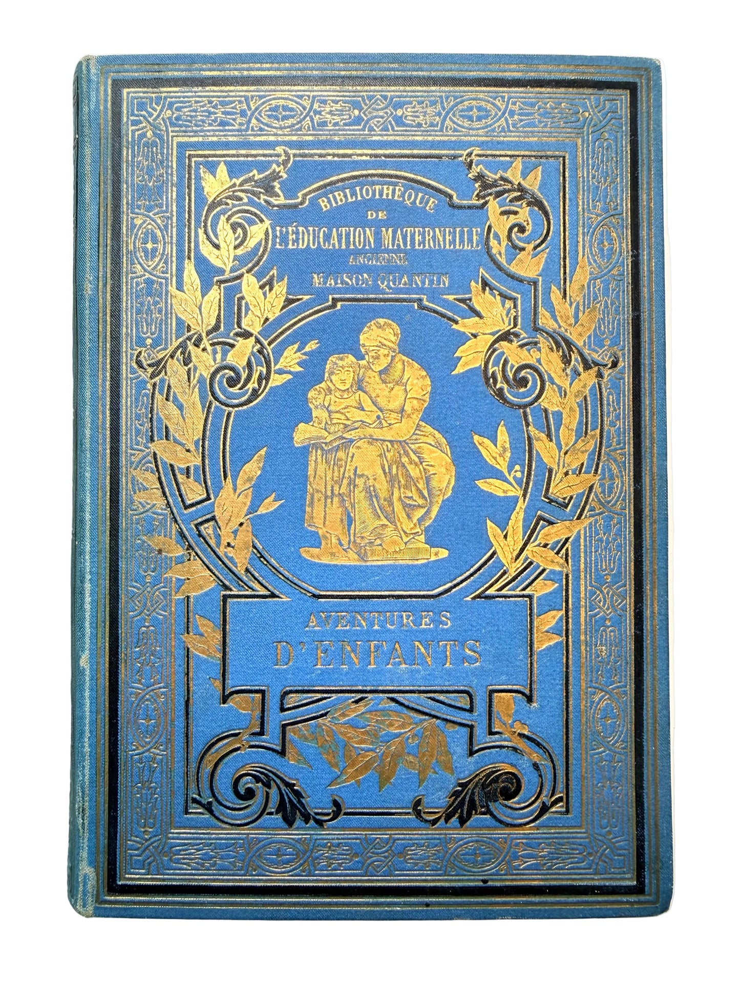 Decorative blue book with gold embossed design on a white background