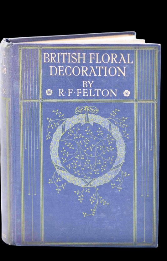 A hardcover book with a dark purple and blue cover featuring a decorative floral design and the title 'BRITISH FLORAL DECORATION' by R. FELTON.