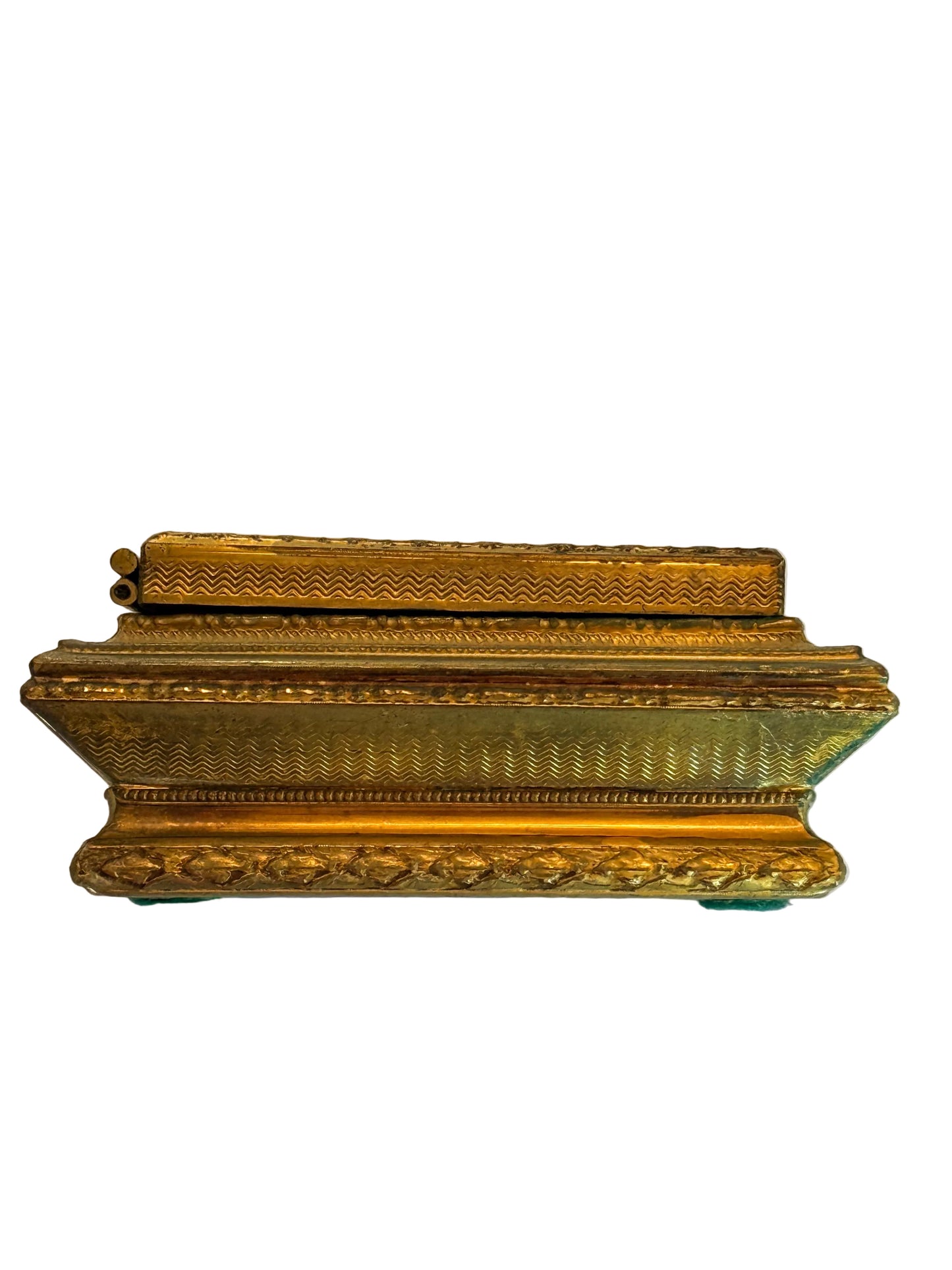 Decorative gold box on a white fabric background