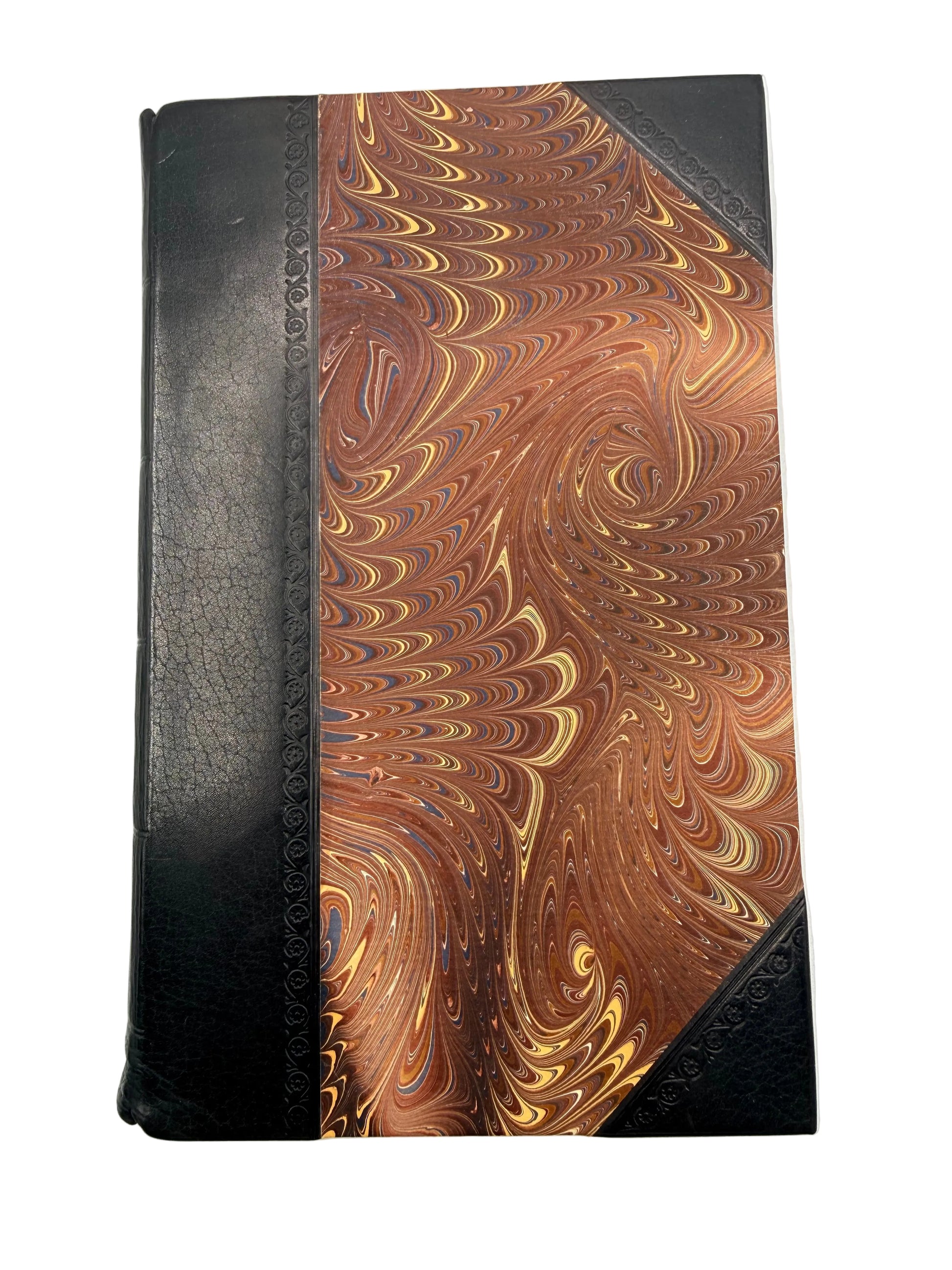 A marbled book cover with black leather spine.