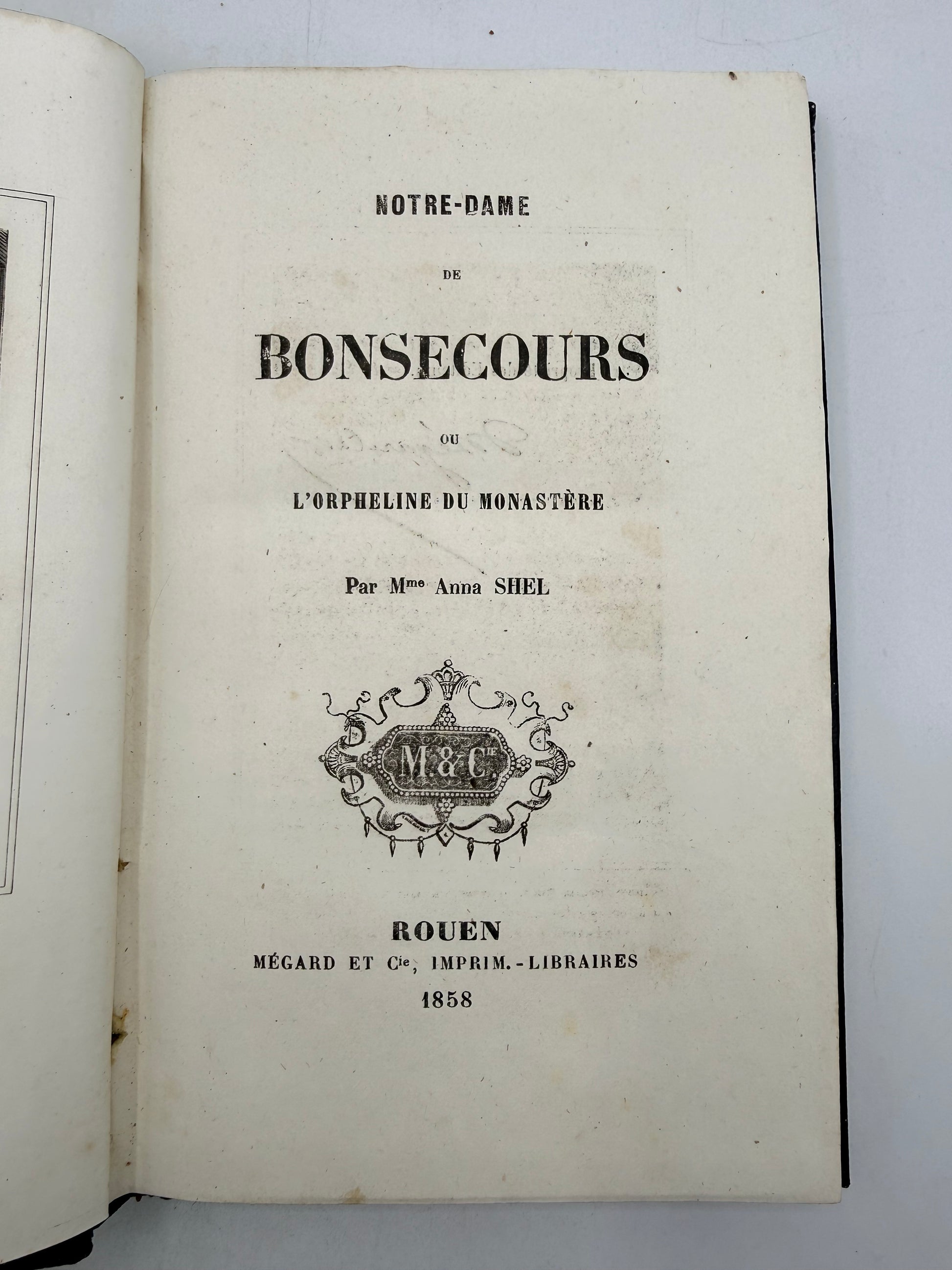 Open book with text and a logo on a white background