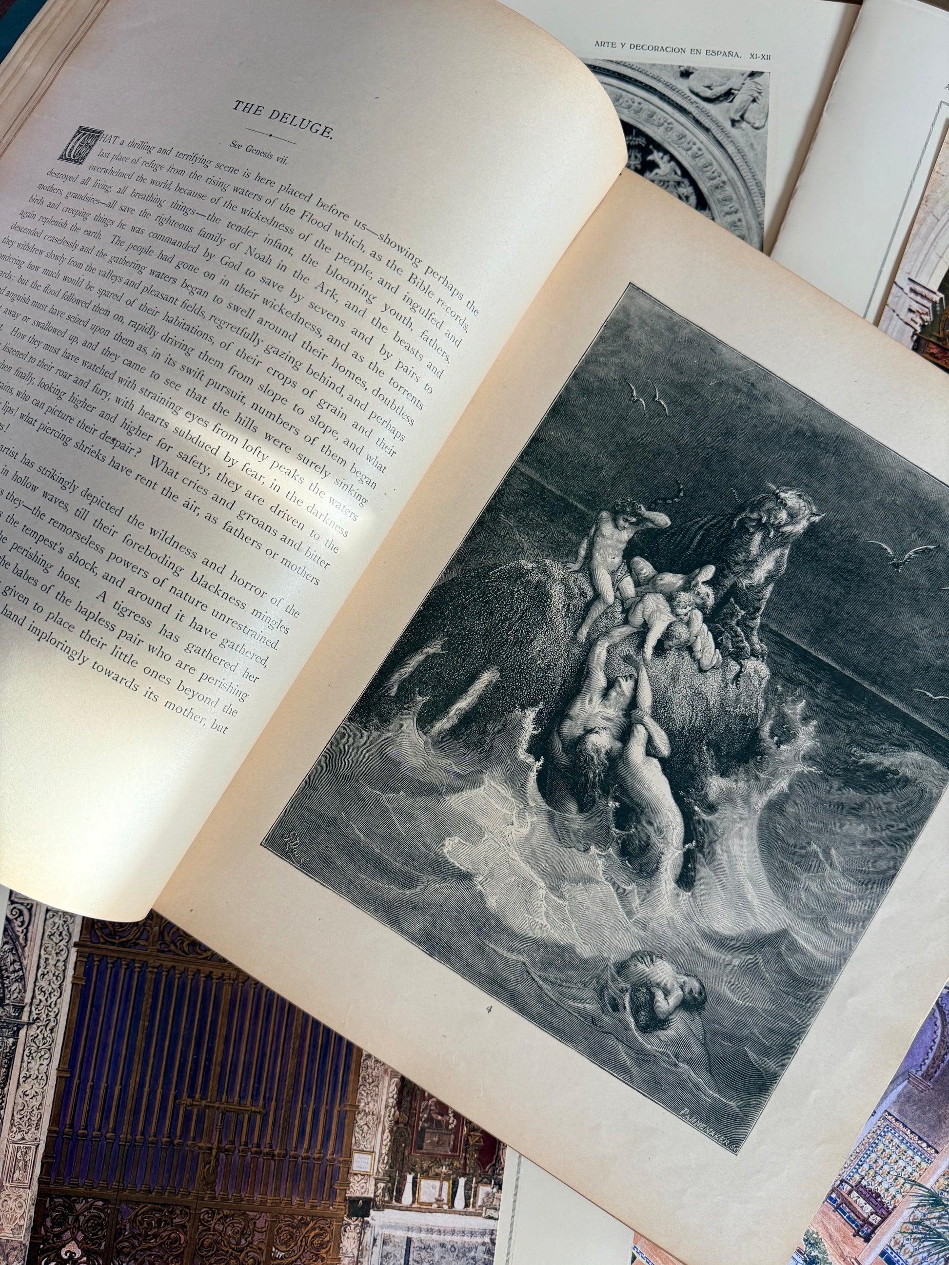 Open book with a black and white illustration of classical scene