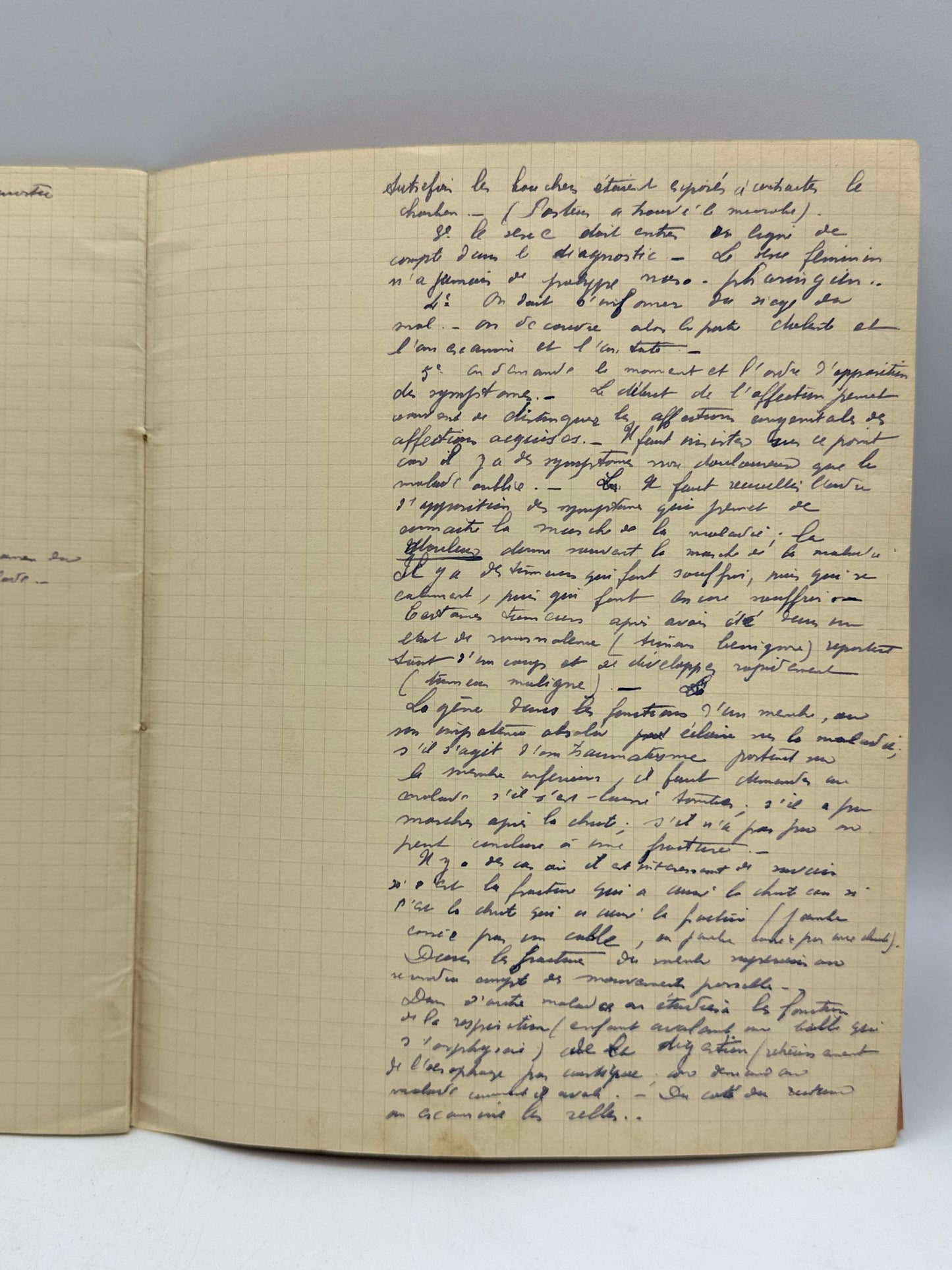 Open notebook with handwritten text on a white background