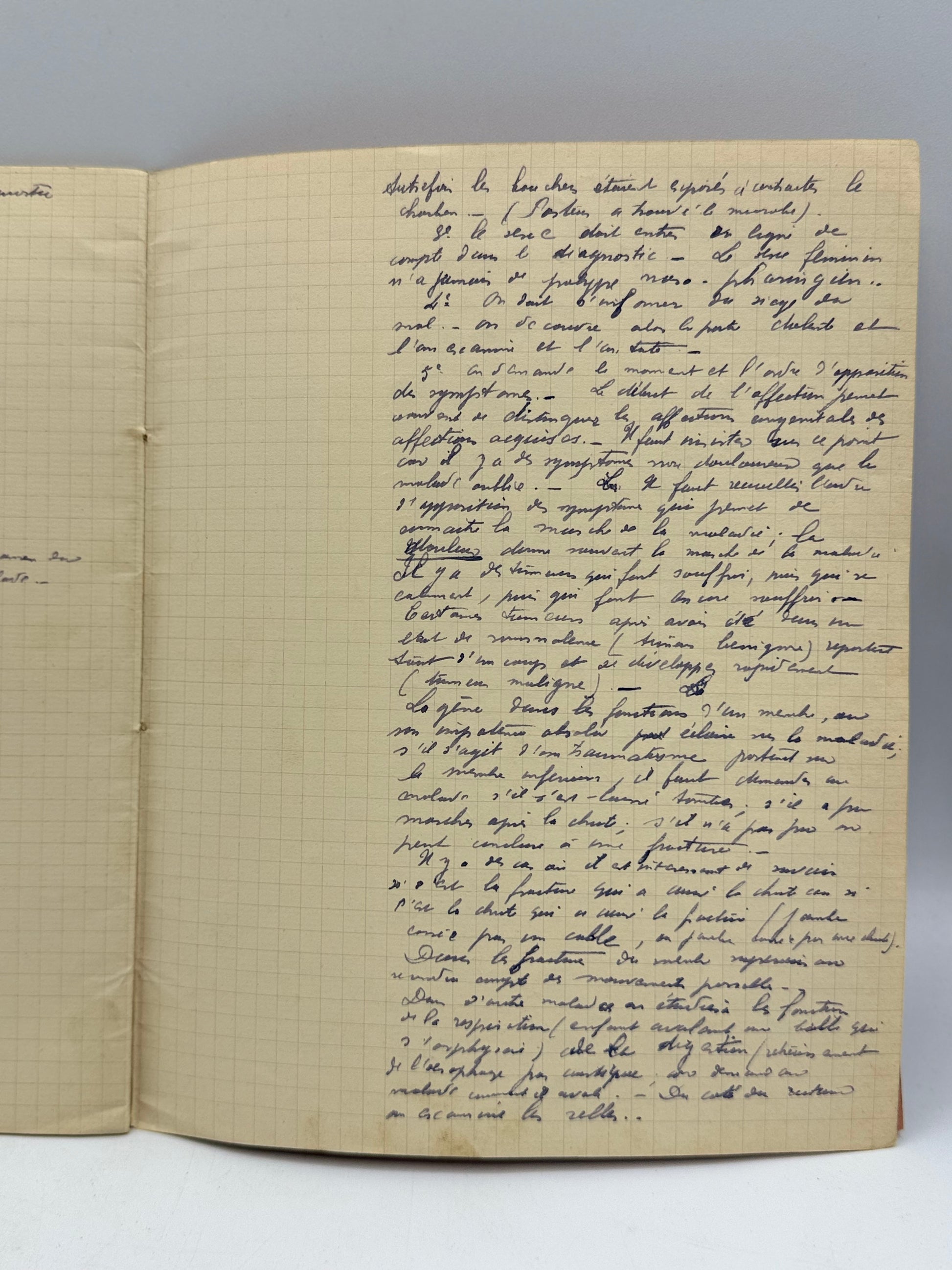 Open notebook with handwritten text on a white background