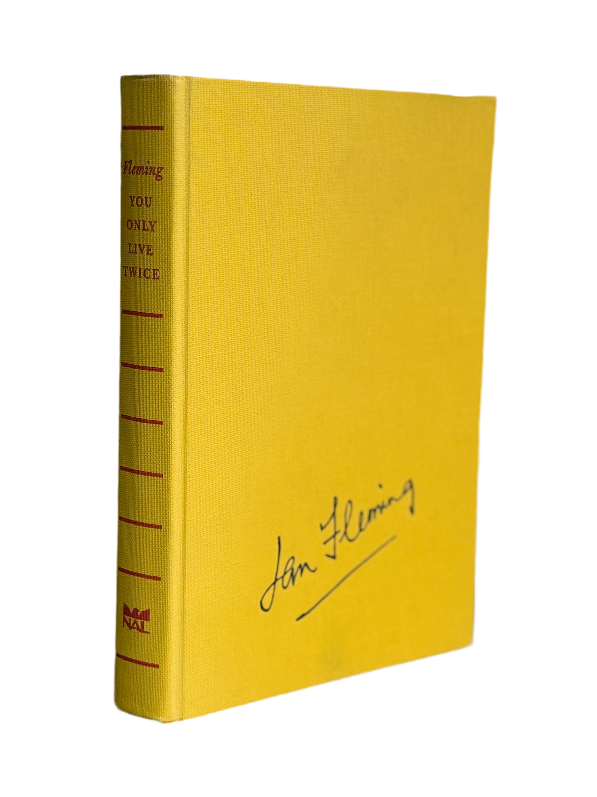 Yellow book, James Bond Vintage Novel, with text and a signature on a white background. You Only Live Twice