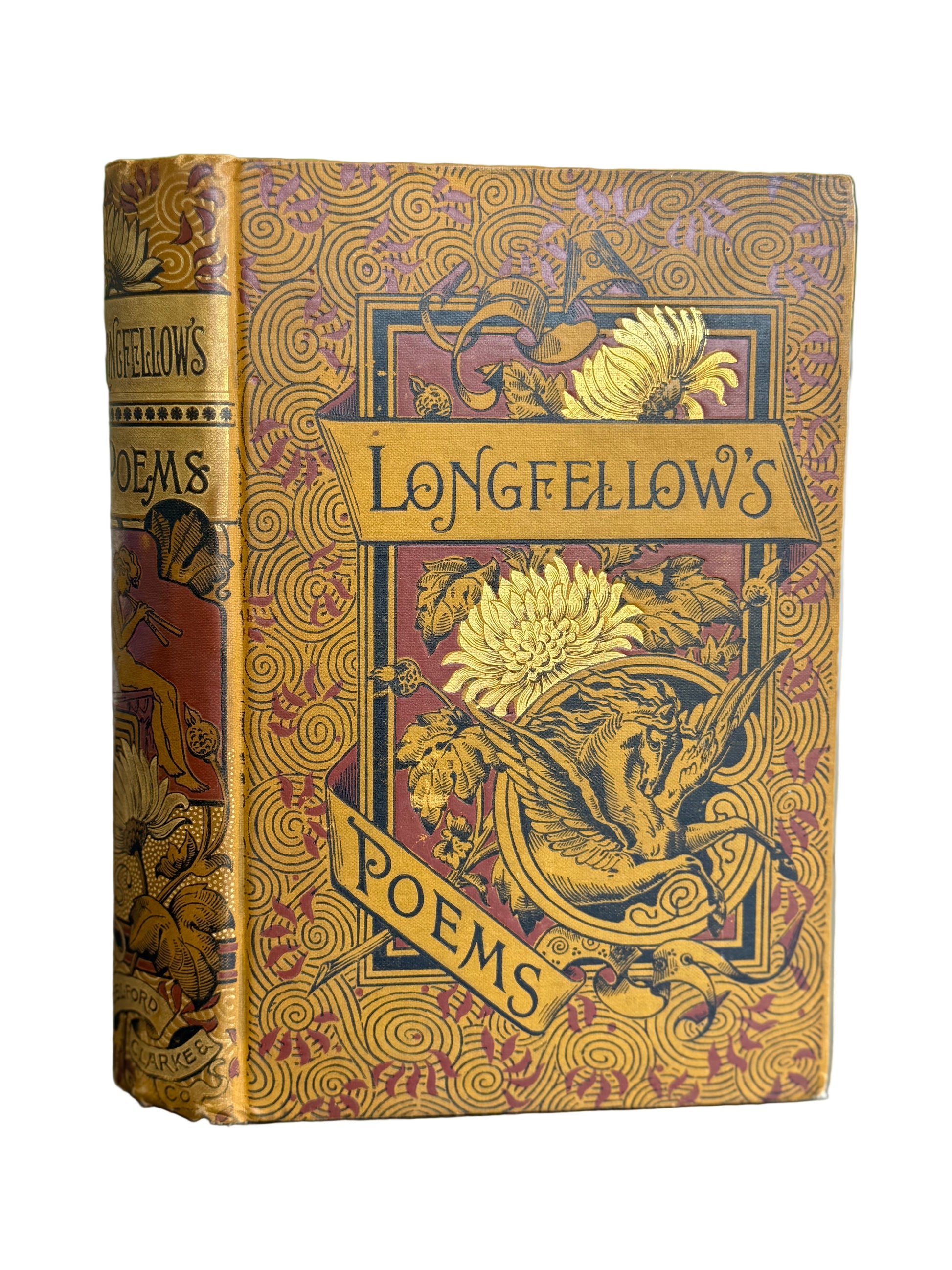 Decorative book cover of 'Longfellow's Poems' with intricate designs on a blurred background