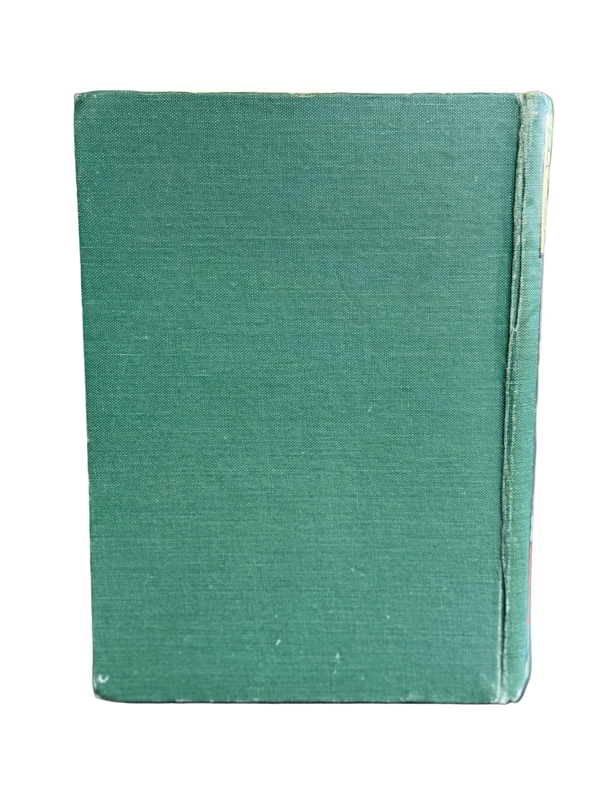 Green book on a wooden surface with a blurred natural background. Peggy DO Book Cassell and Company 