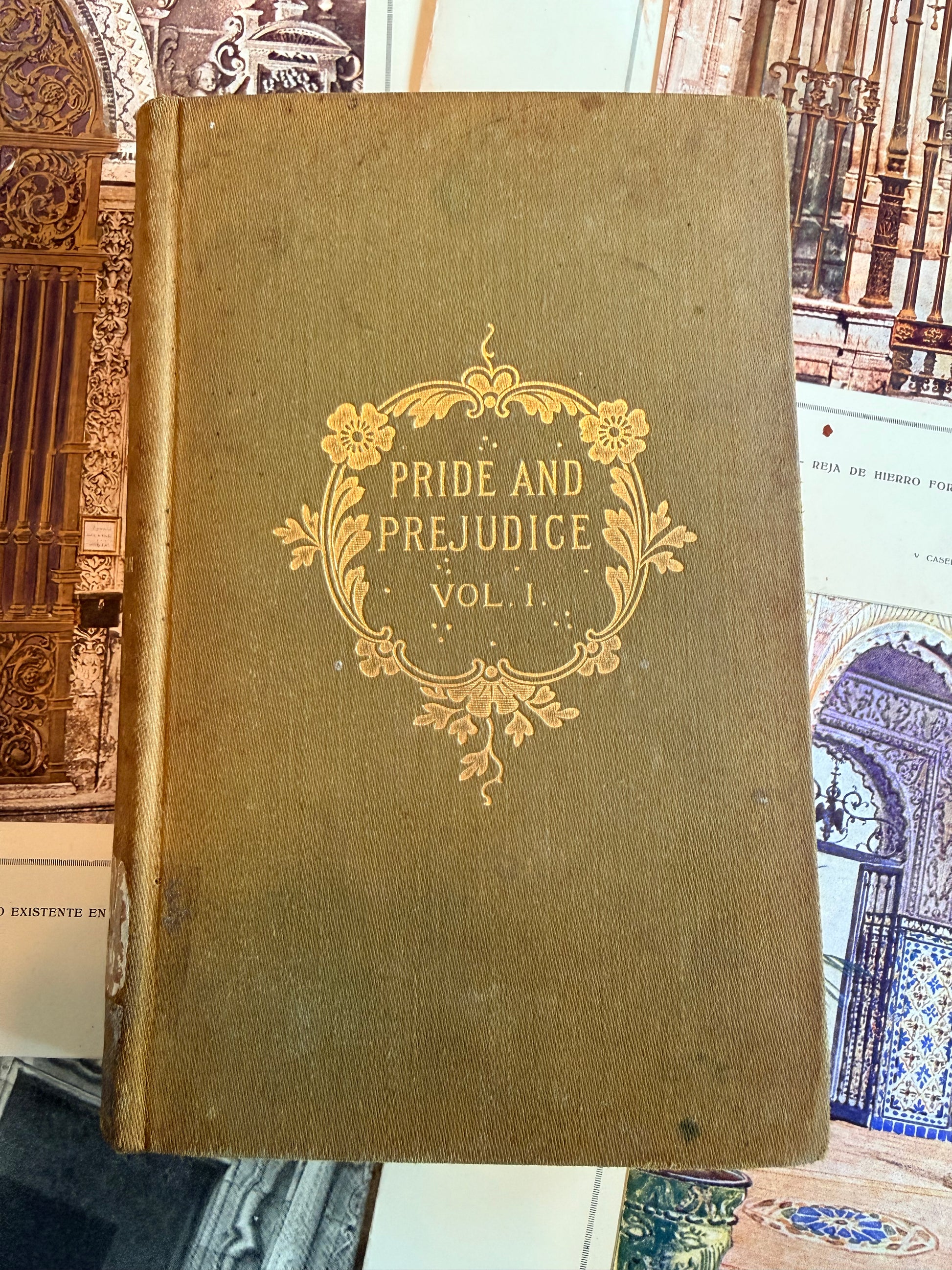 Vintage book titled 'Pride and Prejudice' with decorative cover on a collage background