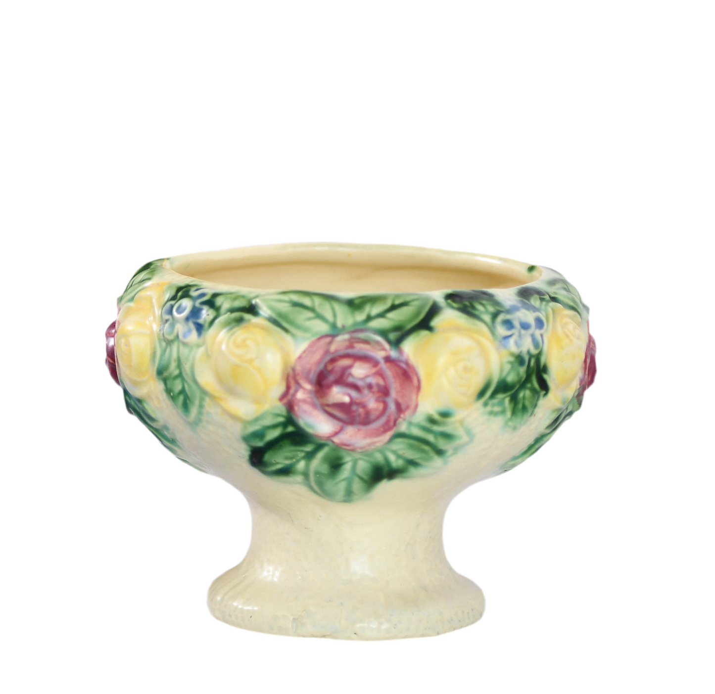Decorative ceramic footed bowl with floral design on a white background