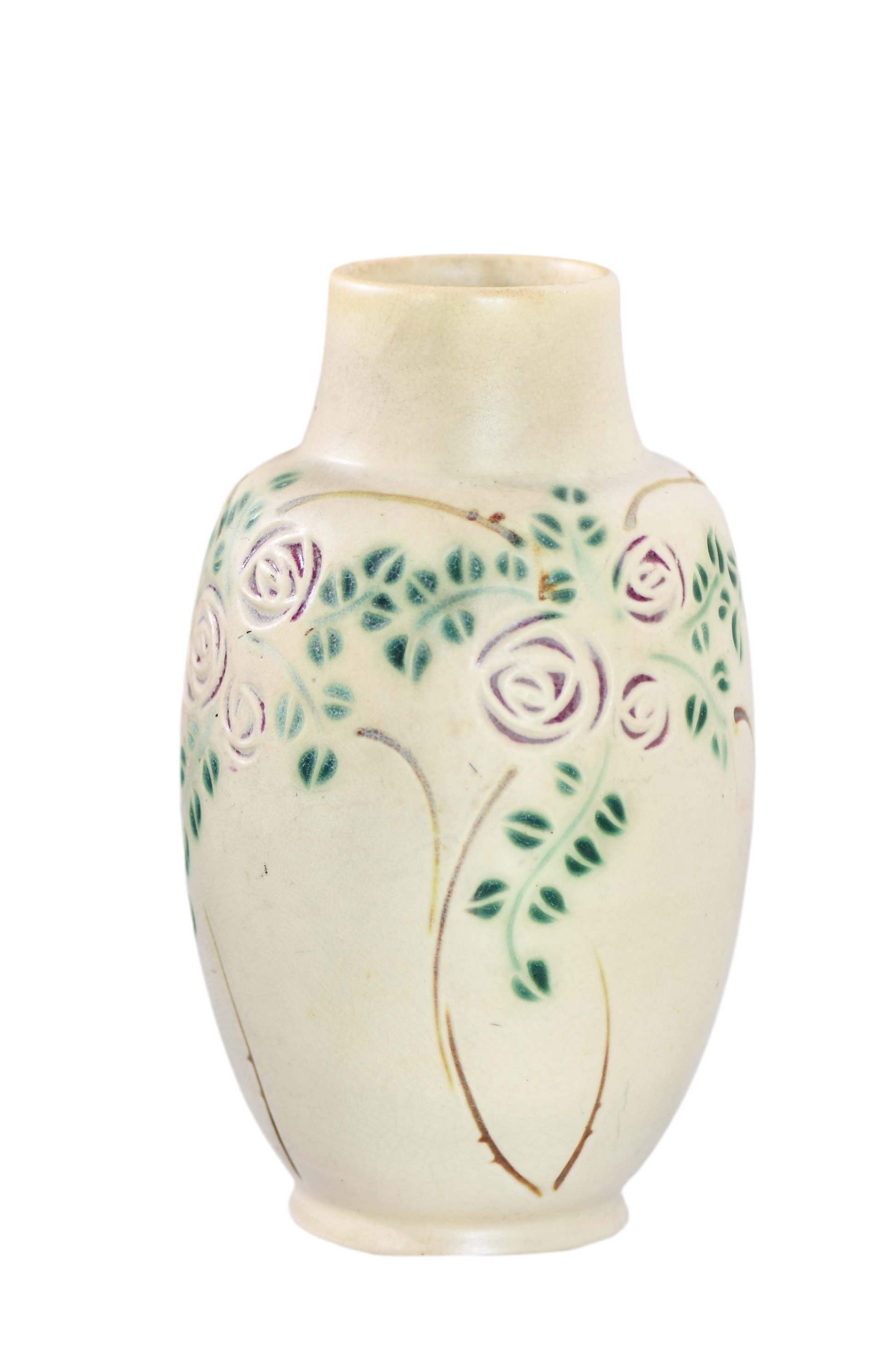 Ceramic vase with floral design on a white background