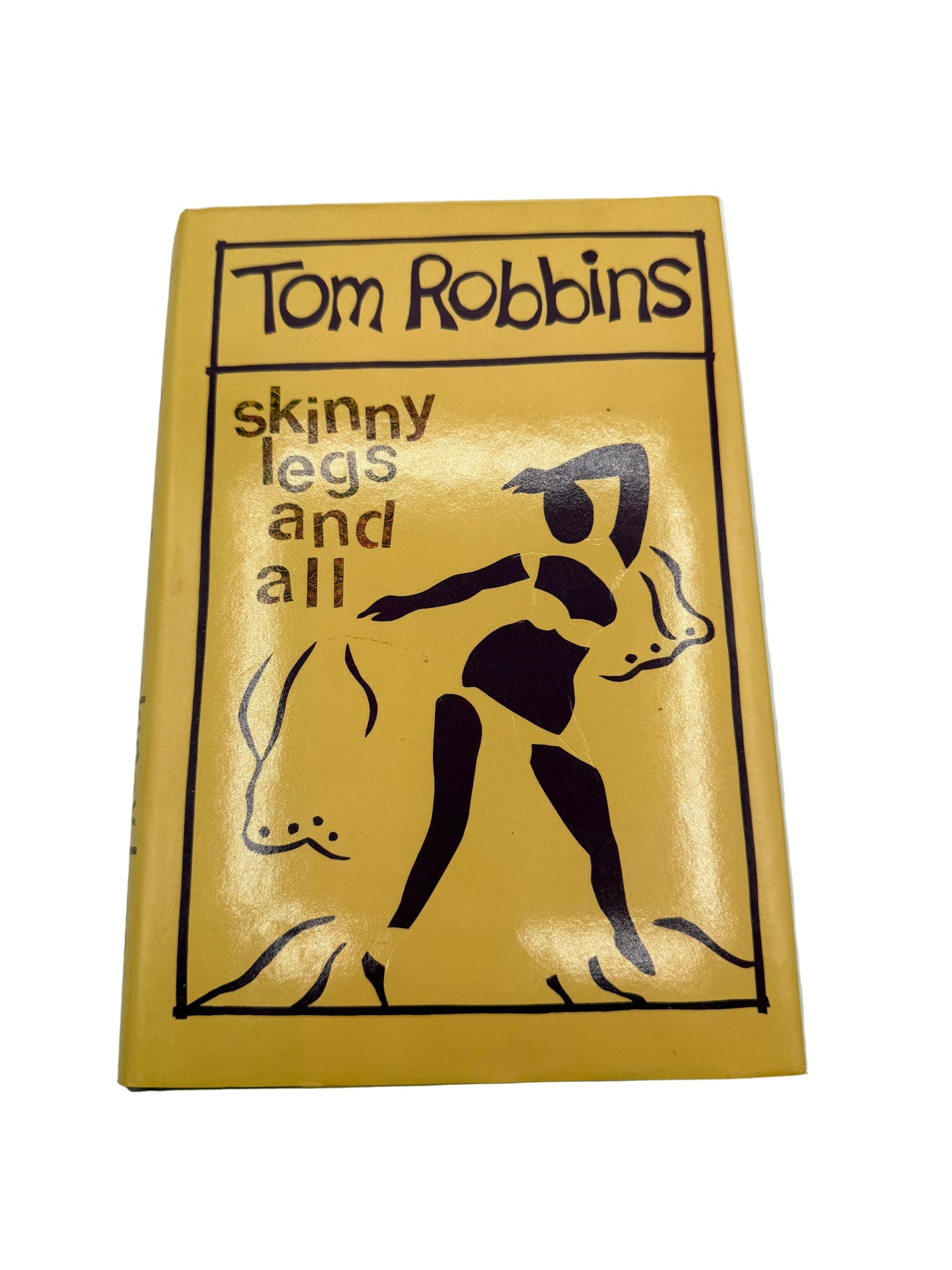 Book cover of 'Skinny Legs and All' by Tom Robbins on a white background