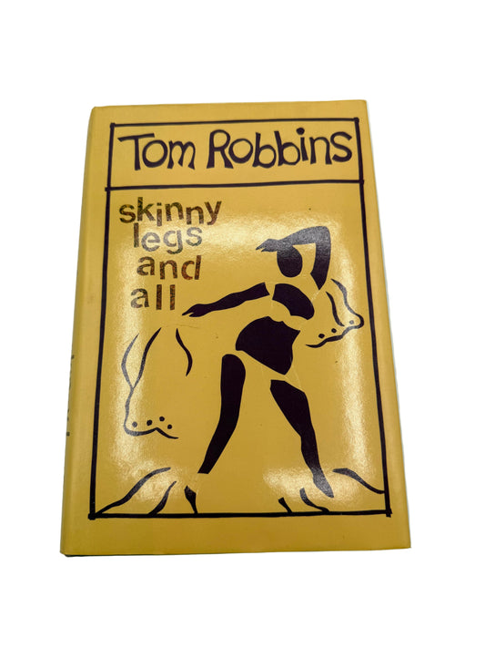 Book cover of 'Skinny Legs and All' by Tom Robbins on a white background