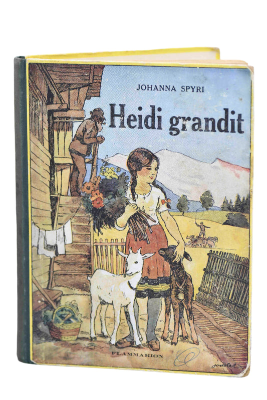 Cover of 'Heidi Grandit' featuring an illustration of a girl with goats and a mountainous background, published by Flammarion, Paris.