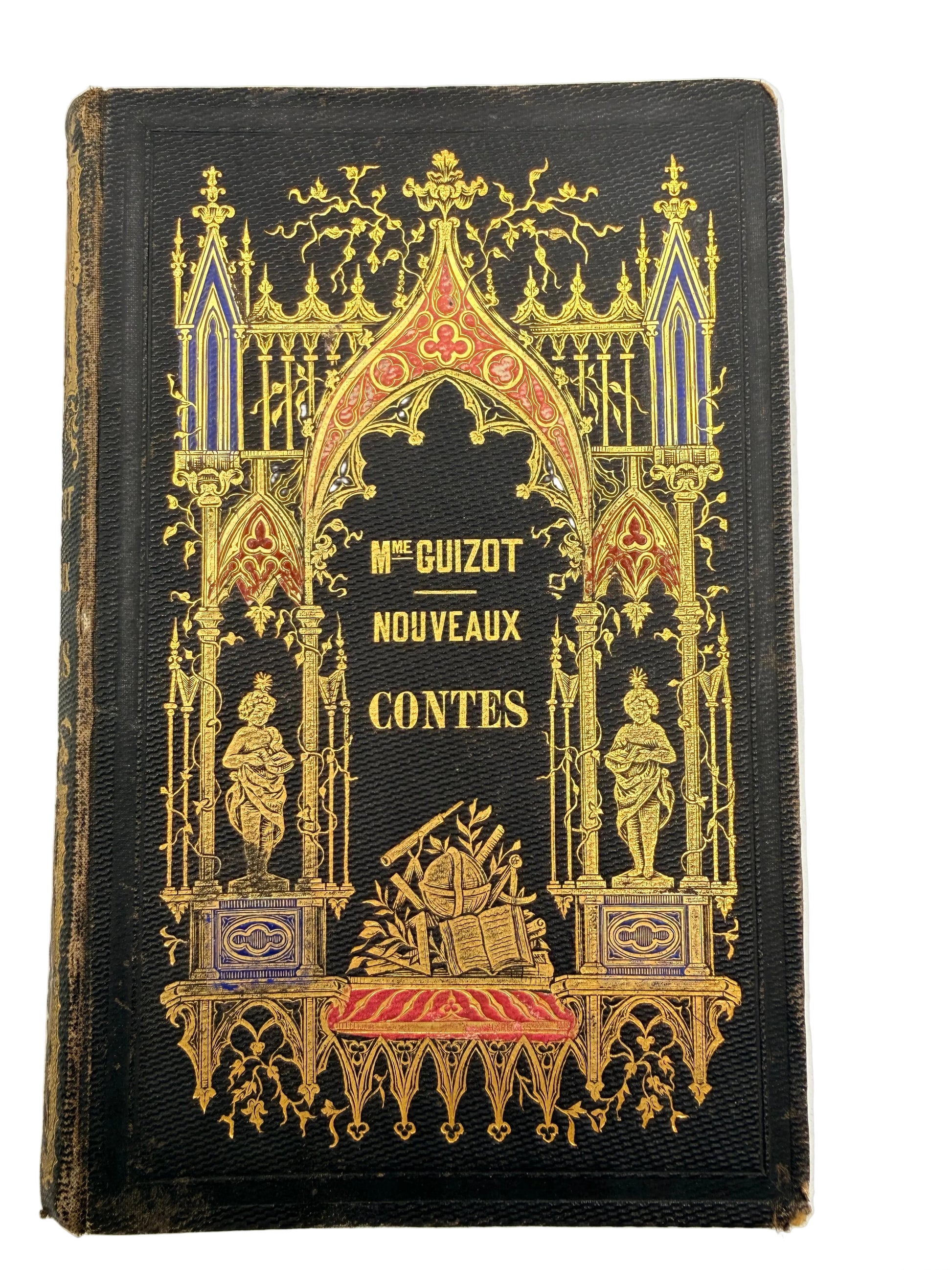 Decorative book cover with intricate gold designs on a black background