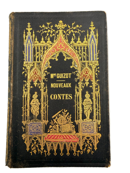 Decorative book cover with intricate gold designs on a black background