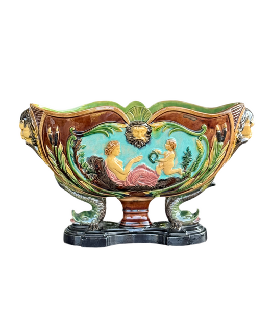 Decorative ceramic planter with classical design on a white background